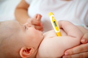 Mother checking baby's temperature